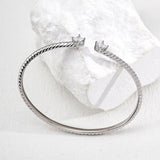 Silver bracelet with star-shaped clasps on a white background