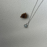Heart-shaped pendant necklace on a plain white background