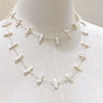 Necklace on a mannequin with a plain background